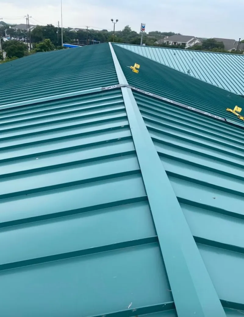 Green commercial metal roof ridge and valley for Metal Roof Repair in Ludlow